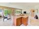 Stylish kitchen island with granite countertops, seating, and an open view to living area at 518 Cortez Dr, Davenport, FL 33837