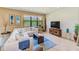Bright living room features a large window, comfortable seating, and a stylish decor at 518 Cortez Dr, Davenport, FL 33837