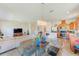 Open-concept living space combines the living, dining, and kitchen areas for easy entertaining at 518 Cortez Dr, Davenport, FL 33837