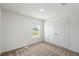 Carpeted bedroom featuring a double door closet and a window overlooking the community at 567 Bay Leaf Dr, Poinciana, FL 34759