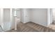 The hallway has plush carpeting and access to the bedrooms of the home at 567 Bay Leaf Dr, Poinciana, FL 34759