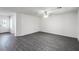 Spacious living room featuring modern grey flooring and a bright entryway at 576 Bay Leaf Dr, Poinciana, FL 34759
