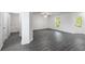 Bright living room featuring modern grey flooring and a view to the outside at 576 Bay Leaf Dr, Poinciana, FL 34759