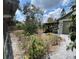 View of the backyard with garage, landscaping, and storage shed at 606 El Vedado Ave, Orlando, FL 32807