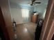 A bedroom featuring a ceiling fan, carpet floors, a dresser, and one window covered with curtains at 606 El Vedado Ave, Orlando, FL 32807