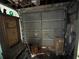 View of the inside of the garage with a cluttered floor and visible door mechanism at 606 El Vedado Ave, Orlando, FL 32807