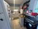 A compact kitchen featuring tiled floors and ample storage at 606 El Vedado Ave, Orlando, FL 32807