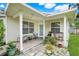 Covered back porch perfect for relaxing with outdoor seating and plants at 830 Polk St, Orlando, FL 32805
