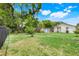 A spacious backyard area with a small shed and a fenced in area at 830 Polk St, Orlando, FL 32805