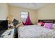 Bedroom featuring a bed with a Paris themed comforter, window and AC at 830 Polk St, Orlando, FL 32805