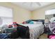 Bedroom featuring a bed with a gray comforter, window, and AC at 830 Polk St, Orlando, FL 32805