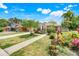 Charming single-story home with a well-manicured lawn and colorful landscaping at 830 Polk St, Orlando, FL 32805