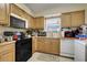 Functional kitchen with appliances, cabinets, and sink at 830 Polk St, Orlando, FL 32805