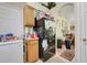 A quaint kitchen featuring an archway and a black refrigerator full of personality and decor at 830 Polk St, Orlando, FL 32805