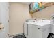 A laundry room featuring a washer and dryer set with ample shelving at 830 Polk St, Orlando, FL 32805