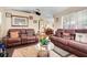 Comfortable living room with two sofas, area rug, and view to dining room at 830 Polk St, Orlando, FL 32805
