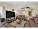 Comfortable living room with large television and plenty of seating at 830 Polk St, Orlando, FL 32805