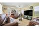 Comfortable living room with large television and plenty of seating at 830 Polk St, Orlando, FL 32805