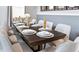Elegant dining room with a long wooden table set for a formal meal and comfortable seating for ten at 3008 Protagonist St, Kissimmee, FL 34746