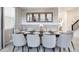 Sophisticated dining room featuring a modern table with seating for ten and stylish decor at 3008 Protagonist St, Kissimmee, FL 34746