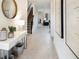 Inviting foyer with neutral floors, modern decor, console table, and staircase leading to the upper level at 3008 Protagonist St, Kissimmee, FL 34746