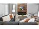 Bright living room with a comfortable sofa, wood-paneled accent wall, and stylish furnishings at 3008 Protagonist St, Kissimmee, FL 34746