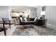 Open-concept living room with modern furnishings, a plush sofa, stylish decor, and a view of the kitchen at 3008 Protagonist St, Kissimmee, FL 34746