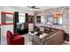 Bright living room with movie-themed decor, comfortable seating, and a flat-screen television at 3008 Protagonist St, Kissimmee, FL 34746