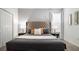 Cozy main bedroom with stylish gray headboard, bedside tables, and neutral decor at 3008 Protagonist St, Kissimmee, FL 34746