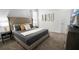 Comfortable main bedroom featuring gray headboard, tv, and natural light from the large window at 3008 Protagonist St, Kissimmee, FL 34746