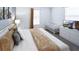 Bright main bedroom featuring a crib, minimalist decor, and a window with natural light at 3008 Protagonist St, Kissimmee, FL 34746