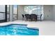 Enjoy outdoor dining poolside with a table and chairs in this tranquil backyard setting at 3008 Protagonist St, Kissimmee, FL 34746