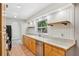 Kitchen featuring tile floors, stainless steel appliances, and white countertops at 520 Hamlet Dr, Port Orange, FL 32127