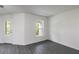 Spacious room with gray wood-look floors and ample natural light from the window at 572 Bay Leaf Dr, Poinciana, FL 34759