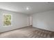 A naturally-lit bedroom with neutral carpeting, fresh paint, and a standard closet at 600 Bay Leaf Dr, Poinciana, FL 34759