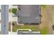 Aerial view of the townhome showing roof, driveway, landscaping and surrounding streets at 1101 Pavia Dr, Apopka, FL 32703