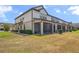 Backyard showing the building's screened porch and outdoor green space at 1101 Pavia Dr, Apopka, FL 32703