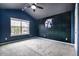 Stylish bedroom with vaulted ceiling, ceiling fan, and large window for ample natural light at 1101 Pavia Dr, Apopka, FL 32703