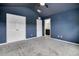 Spacious bedroom with plush carpeting, closet, and ensuite bathroom at 1101 Pavia Dr, Apopka, FL 32703