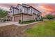 Attractive townhome exterior features two-car garage, neutral colors, and manicured landscaping at 1101 Pavia Dr, Apopka, FL 32703