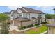 Attractive townhome showcasing its manicured lawn and close proximity to neighborhood amenities at 1101 Pavia Dr, Apopka, FL 32703