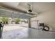 Clean, spacious garage featuring high ceilings, equipment, and a view of the neighborhood at 1101 Pavia Dr, Apopka, FL 32703