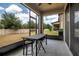 Relaxing screened lanai offers outdoor seating and views of the backyard and landscaping at 1101 Pavia Dr, Apopka, FL 32703