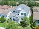 Aerial view of a well-maintained two-story home with a porch and manicured landscaping at 14563 Bahama Swallow Blvd, Winter Garden, FL 34787