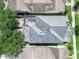 Overhead view of a home featuring a screened-in porch and well maintained roof at 14563 Bahama Swallow Blvd, Winter Garden, FL 34787