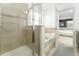 Elegant bathroom featuring a glass-enclosed shower and separate soaking tub at 14563 Bahama Swallow Blvd, Winter Garden, FL 34787