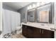 Well-appointed bathroom featuring a vanity with dual mirrors and a shower-tub combination at 14563 Bahama Swallow Blvd, Winter Garden, FL 34787