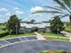 Attractive community clubhouse with lush landscaping, convenient parking, and architectural details at 14563 Bahama Swallow Blvd, Winter Garden, FL 34787
