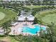 Aerial view of the community pool and clubhouse with ample seating and lake views at 14563 Bahama Swallow Blvd, Winter Garden, FL 34787