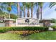 Elegant community sign with lush landscaping and palm trees at 14563 Bahama Swallow Blvd, Winter Garden, FL 34787